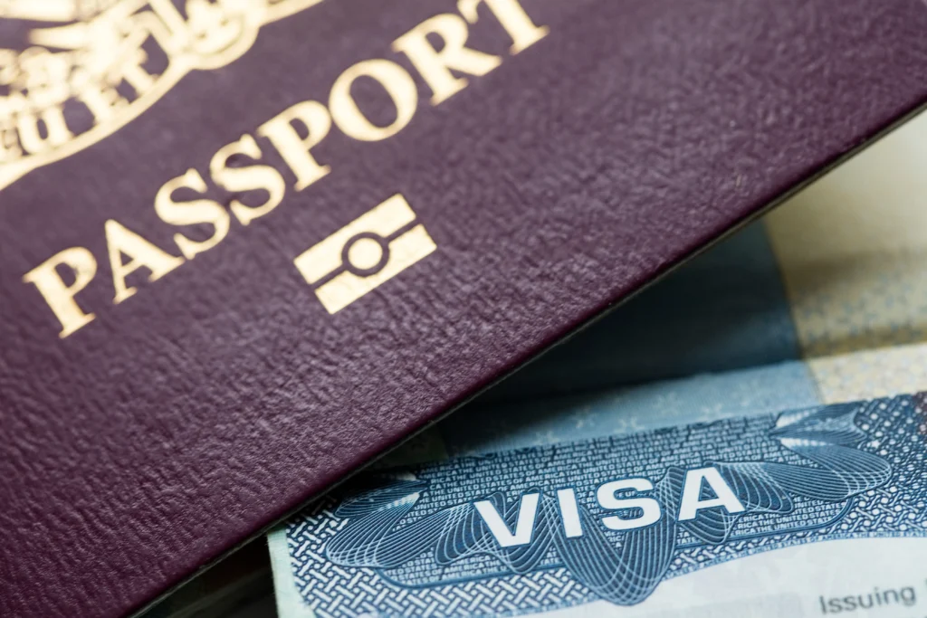 Guide to British Citizenship Featured Image. Close up of a British Passport and Visa Card