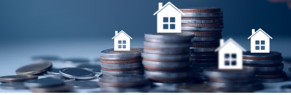 Stacks of coins with small white houses on top - Tenancy Deposit Protection Explained Featured Image
